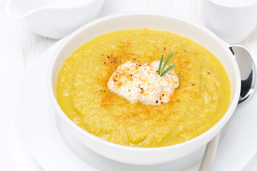 vegetable soup with cream and rosemary, top view