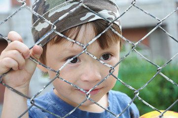 Boy behind bars