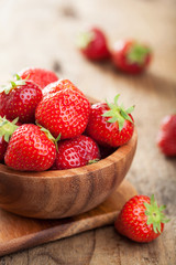 fresh strawberry in wooden bowl