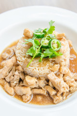 Chicken with brown sauce on rice