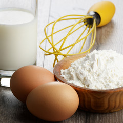 Milk, flour, whisk and eggs