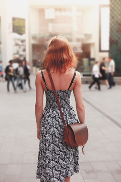 Young woman walking in the street