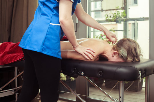 Woman being massaged on a table