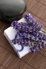 Bar of natural soap and lavender flowers