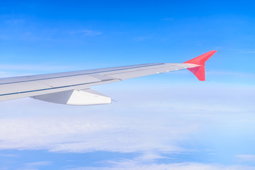 Obraz premium Looking through window aircraft during flight in wing with a nic