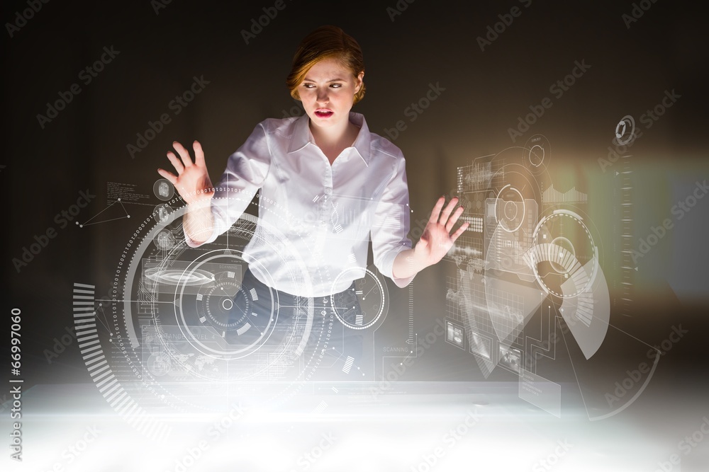 Poster composite image of redhead businesswoman using interactive desk