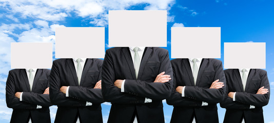Businessman standing white paper face holding front of head