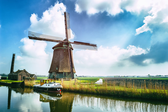 Traditional dutch windmill near the canal