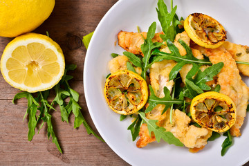 strips of chicken with rocket and lemon
