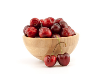 Fototapeta na wymiar Bowl with ripe red cherries
