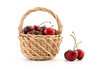 Fototapeta na wymiar Basket with red ripe cherries