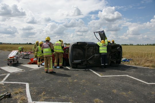 fier crew working on acrashed car