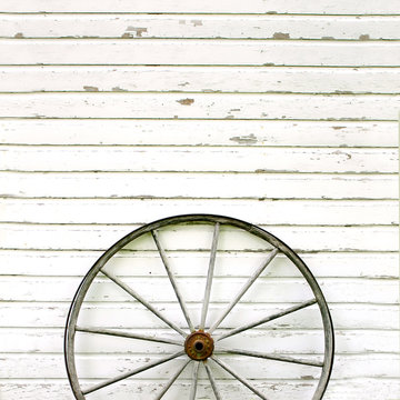 Antique Wooden Wagon Wheel on Rustic White Background