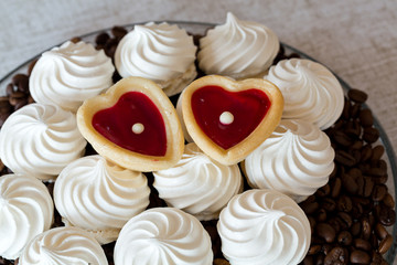 French vanilla meringue cookies and two sweet hearts