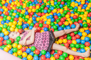Young child playing in ball pool