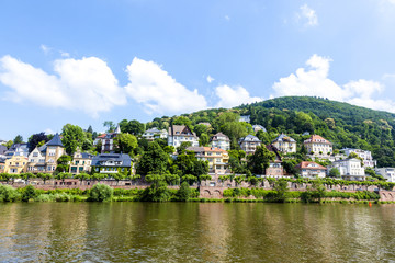 Fototapeta premium Neckar valley with reflection of Heidelberg houses at the river