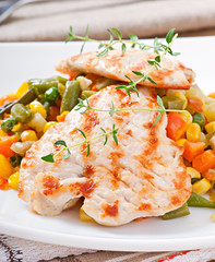 Grilled chicken breasts and vegetables