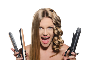 Young woman keeps hair curlers and rectifier