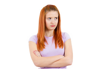 Grumpy, jealous young woman isolated on white background 