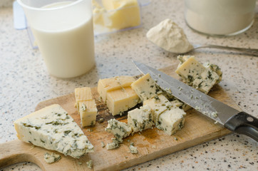 Blue cheese cutted on wooden plate