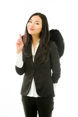 Asian young businesswoman dressed up as black angel with her