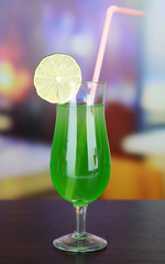 Tasty cocktail on bright background