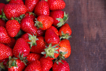 Ripe sweet strawberries  on color wooden background