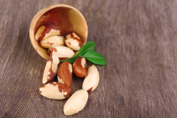 Tasty brasil nuts on wooden background
