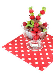 Chocolate ice cream with mint leaf and  ripe berries in glass