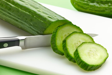 fresh cucumber on cutting board