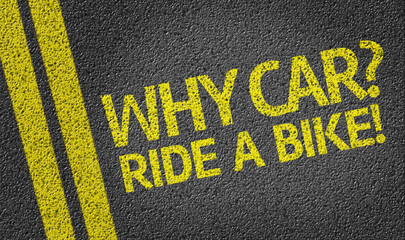 Why Car? Ride a Bike! written on the road