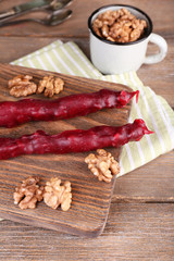 Tasty oriental sweets (churchkhela) and fresh nuts,