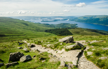 Fototapeta na wymiar Path leading to the top of Ben Lomond in a sunny day.