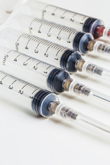 Disposable syringe in the row