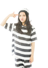 Young Asian woman shooting herself in head in prisoners uniform