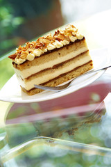 close up coffee cake and nut in white dish