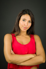 Obraz premium Portrait of a confident young woman with her arms crossed