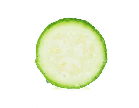 Zucchini. Sliced green courgette on white background