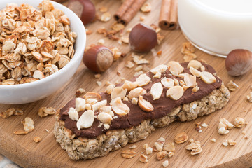oat bar with chocolate on wooden board