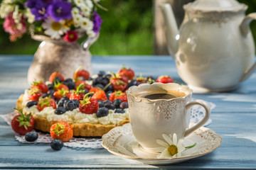 Coffee and fruit tarts served in the garden