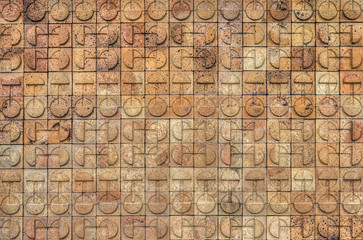Circle design on bricks of a brick wall