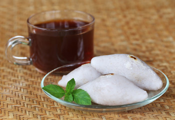 Handmade Indian cuisine of rice flour with cup of tea