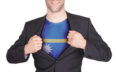 Businessman opening suit to reveal shirt with flag