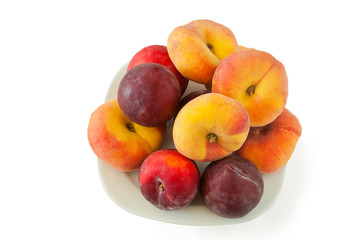 Fototapeta na wymiar Flat peaches and plums greengage