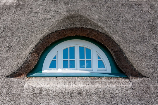 Dormer of a thatched-roof house