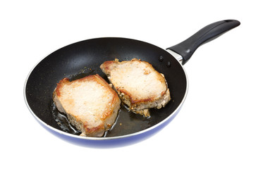Pork loin steaks frying in pan