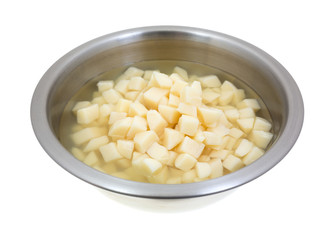 Stainless steel bowl with diced potatoes