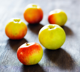 Ripe apples on black table