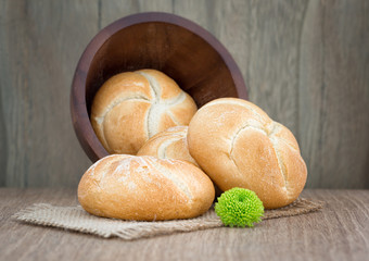 Homemade fresh bread buns  on old wooden table, selective focus
