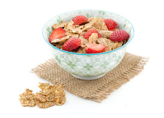 Morning breakfast with cornflakes and fresh stawberry